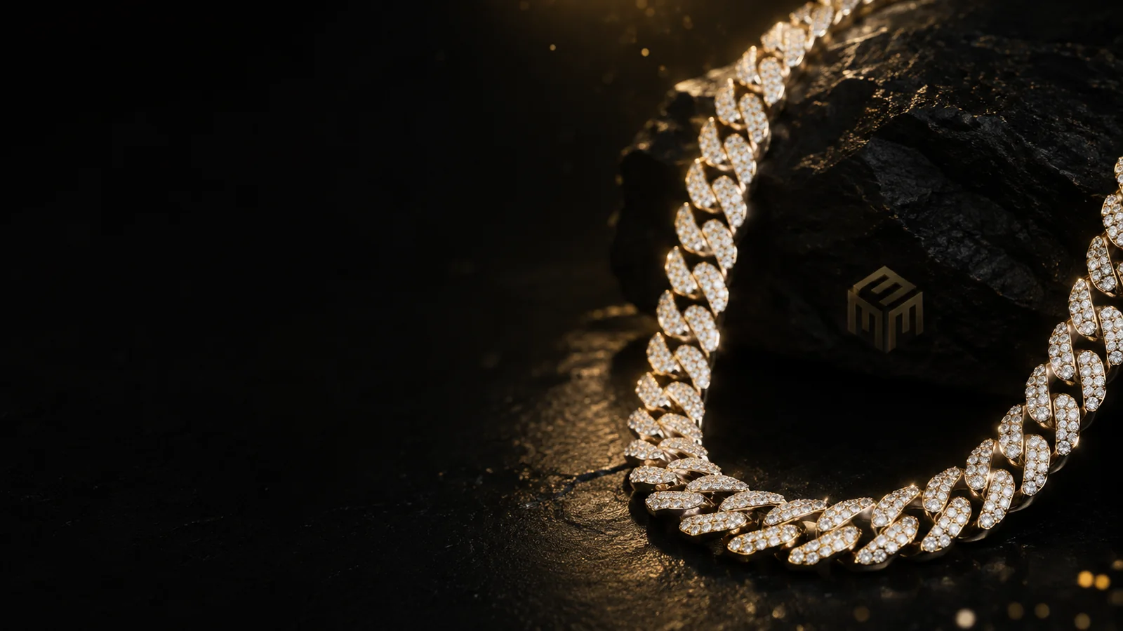 M3 Jewelers moissanite chain styled on a black and gold luxury setting